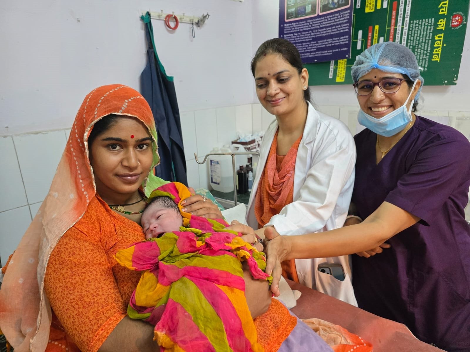 Midwife supporting a woman during labour in a calm birthing room