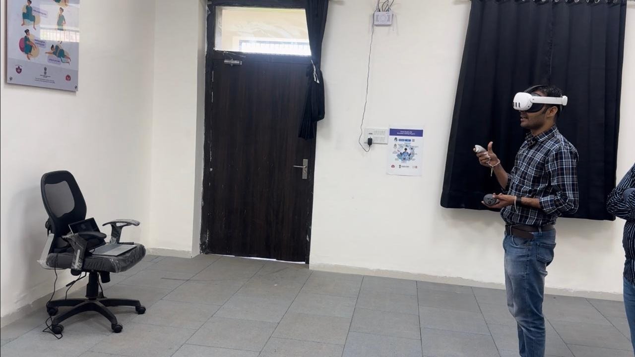 Midwifery students practising on a delivery simulator in a skills lab